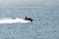 Man riding a jet ski shooting in backlit Royalty Free Stock Photo