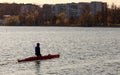 A man is riding a kayak