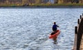 A man is riding a kayak