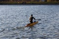 A man is riding a kayak