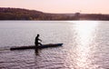 A man is riding a kayak