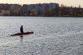 A man is riding a kayak