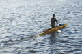 A man is riding a kayak