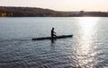 A man is riding a kayak