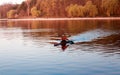 A man is riding a kayak