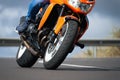 Man riding motorcycle in asphalt road curve with rural Royalty Free Stock Photo