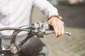 Man riding motorcycle, close up of hand on handlebar Royalty Free Stock Photo