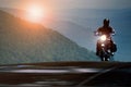 Man riding motorcycle on mountain highway Royalty Free Stock Photo