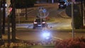 Man riding motorcycle at night, quick meal delivery service in big city, comfort