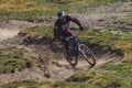 Man riding mountain bicycle downhill