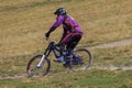 Man riding mountain bicycle downhill