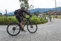 A man riding mountain bicycle over a asphalt road at bogota mountains
