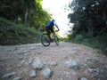 Man Riding Mountain Bike On Rocks Trail. Royalty Free Stock Photo