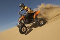 Man Riding Quad Bike In Desert Royalty Free Stock Photo