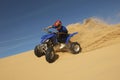 Man Riding Quad Bike In Desert Royalty Free Stock Photo