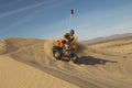 Man Riding Quad Bike In Desert