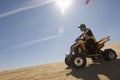 Man Riding Quad Bike In Desert Royalty Free Stock Photo