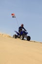 Man Riding Quad Bike In Desert Royalty Free Stock Photo