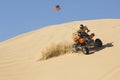 Man Riding Quad Bike In Desert Royalty Free Stock Photo