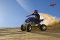 Man Riding Quad Bike In Desert Royalty Free Stock Photo