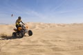 Man Riding Quad Bike In Desert Royalty Free Stock Photo