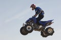 Man Riding Quad Bike In Midair Against Sky Royalty Free Stock Photo