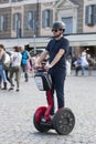 Man riding red segway