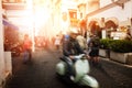 Man riding scooter motorcycle in amalfi street south italy most