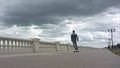 Man riding a skateboard and loosing balance. Royalty Free Stock Photo