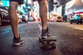 Man riding on skateboard in New York City street at the night Royalty Free Stock Photo
