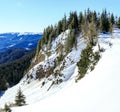 A man riding skis down the side of a snow covered mountain Royalty Free Stock Photo