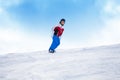 Man riding on the snowboard down mountain hill Royalty Free Stock Photo