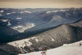 A man riding a snowboard down a snow covered mountain Royalty Free Stock Photo