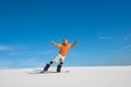 Man is riding on snowboard on sand dune Royalty Free Stock Photo