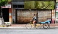 A man riding tricycle on street in Chaudok, Vietnam Royalty Free Stock Photo