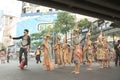 Man riding unicycle taking selfie with Group of Thai traditional dancers