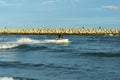 A man riding a water scooter Summer vacation in the tropical sea The hobby of a young man riding the sea Royalty Free Stock Photo