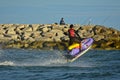 A man riding a water scooter Summer vacation in the tropical sea The hobby of a young man riding the sea Water sport