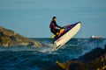 A man riding a water scooter Summer vacation in the tropical sea The hobby of a young man riding the sea Water sport