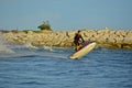 A man riding a water scooter Summer vacation in the tropical sea The hobby of a young man riding the sea Water sport