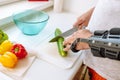 Man with injured hand making salad