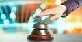 Man ringing hotel service bell on blurred background, closeup. Banner design