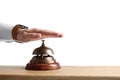 Man ringing hotel service bell at table Royalty Free Stock Photo