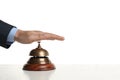 Man ringing hotel service bell at table Royalty Free Stock Photo