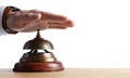 Man ringing hotel service bell at table Royalty Free Stock Photo