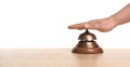 Man ringing hotel service bell at table Royalty Free Stock Photo