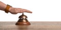 Man ringing hotel service bell at table Royalty Free Stock Photo