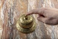 Man ringing in service bell on reception table, closeup Royalty Free Stock Photo