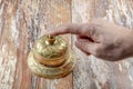 Man ringing in service bell on reception table, closeup Royalty Free Stock Photo