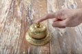 Man ringing in service bell on reception table, closeup Royalty Free Stock Photo